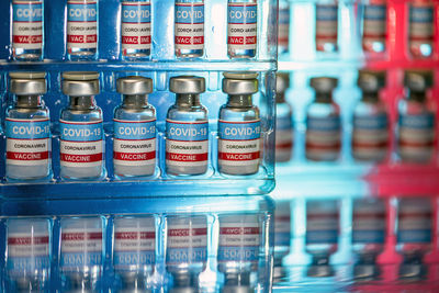 Close-up of bottles in shelf at store