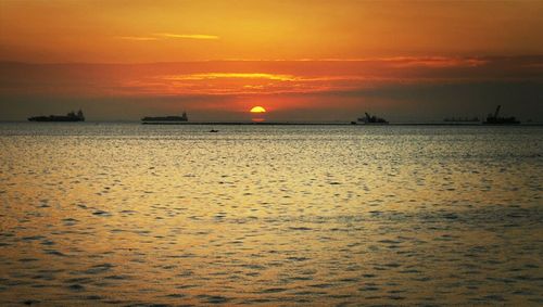 Scenic view of sea at sunset