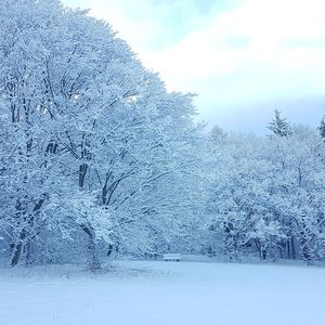 Scenic view of snow covered landscape against sky