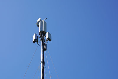 Mobile cell tower against blue sky