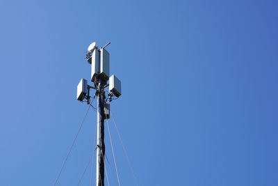 Mobile cell tower against blue sky