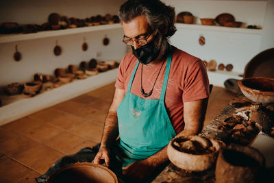 Full length of young man preparing food