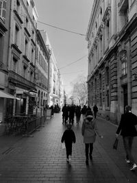 People walking on street in city