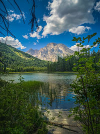 Scenic view of lake and mountains against sky