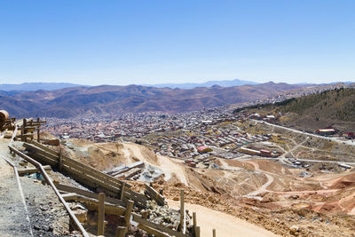 High angle view of landscape against clear blue sky