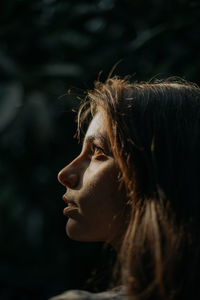 A close up portrait of a woman during sunset