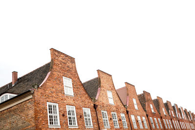 Low angle view of buildings against clear sky