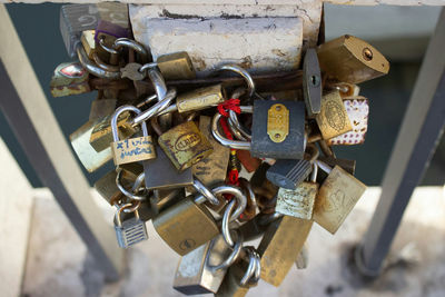 Close-up of padlocks hanging on railing