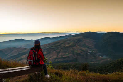 Man looking at mountains