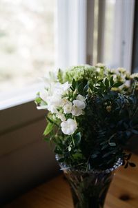 Close-up of white flower vase on table at home