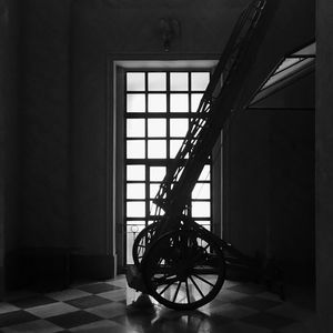 Bicycle leaning against door of building