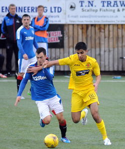 Full length of people playing soccer