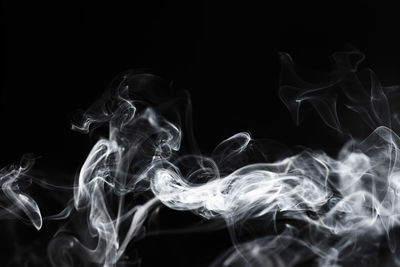 Close-up of smoke against black background