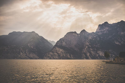 Scenic view of mountains against cloudy sky