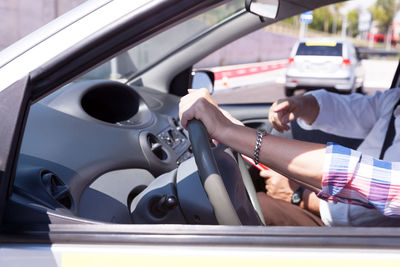 Close-up of hand on car