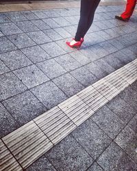 Low section of person on road