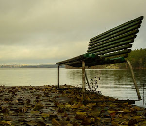 Pier over lake against sky