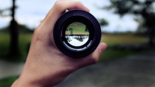 Close-up of hand holding camera