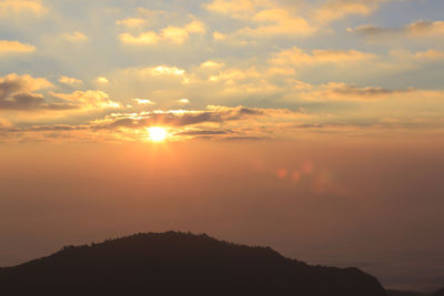 Scenic view of silhouette mountains against sky during sunset