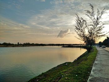 Scenic view of lake against sky during sunset