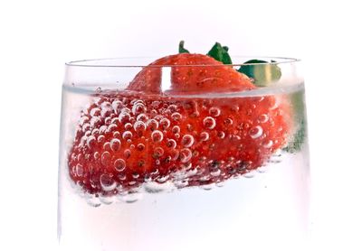 Close-up of strawberry over white background