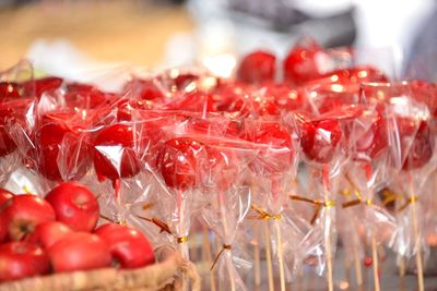 Caramelized red apples on sticks