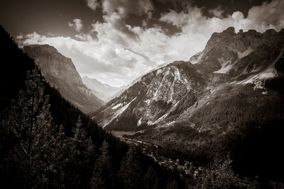 Scenic view of mountains against cloudy sky