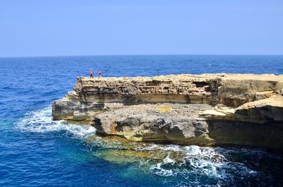 Scenic view of sea against clear blue sky