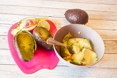 High angle view of fruits in plate on table