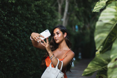 Young woman using mobile phone