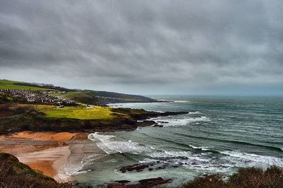 Scenic view of sea against cloudy sky