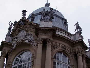 Low angle view of statue against building