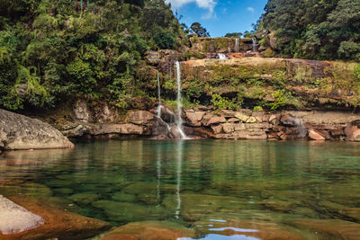 Natural waterfall white water streams with calm clear water at morning