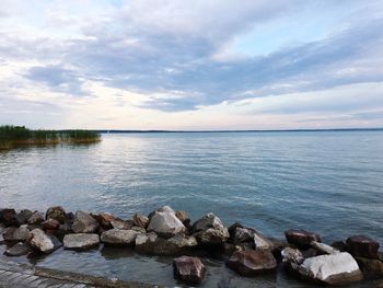 Scenic view of sea against cloudy sky