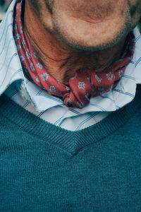 Midsection of man wearing sweater