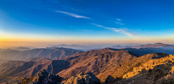 Scenic view of mountains against sky during sunset