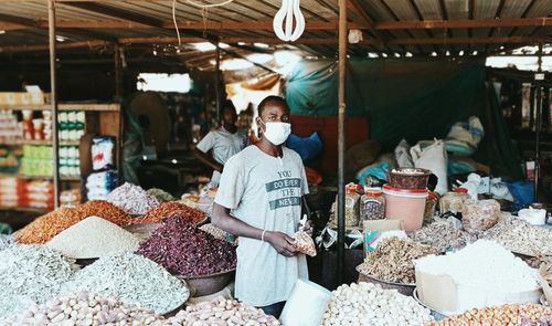 Women for sale at market stall