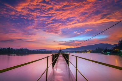 Scenic view of bridge against sky during sunset