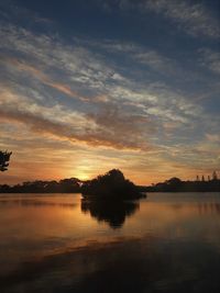 Scenic view of lake against sky during sunset