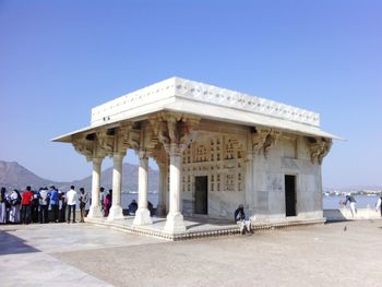 Group of people in front of historical building