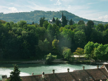 Scenic view of river and trees against sky