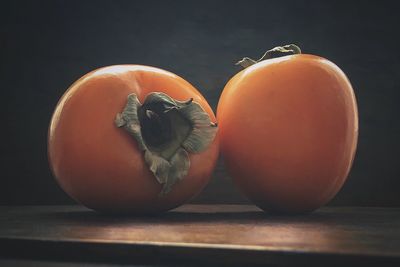 Close-up of oranges on table