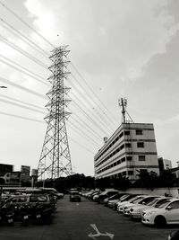 Traffic on road in city against sky