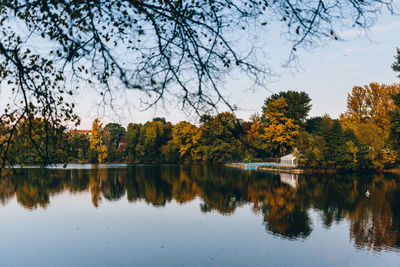 Reflection of trees in lake against sky during autumn