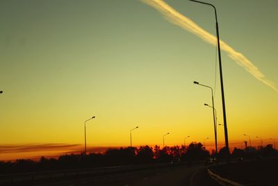 Street against sky during sunset