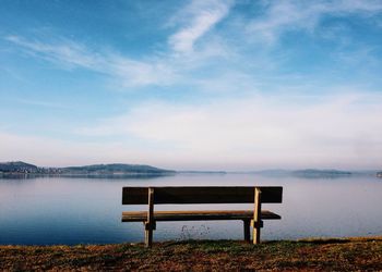 Empty pier on calm lake