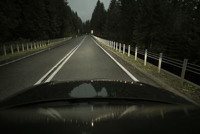 Road seen through car at night