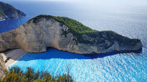 Panoramic view of rocks on beach against sky