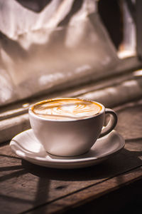 Close-up of cappuccino on table