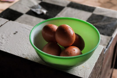 High angle view of fruits in bowl on table